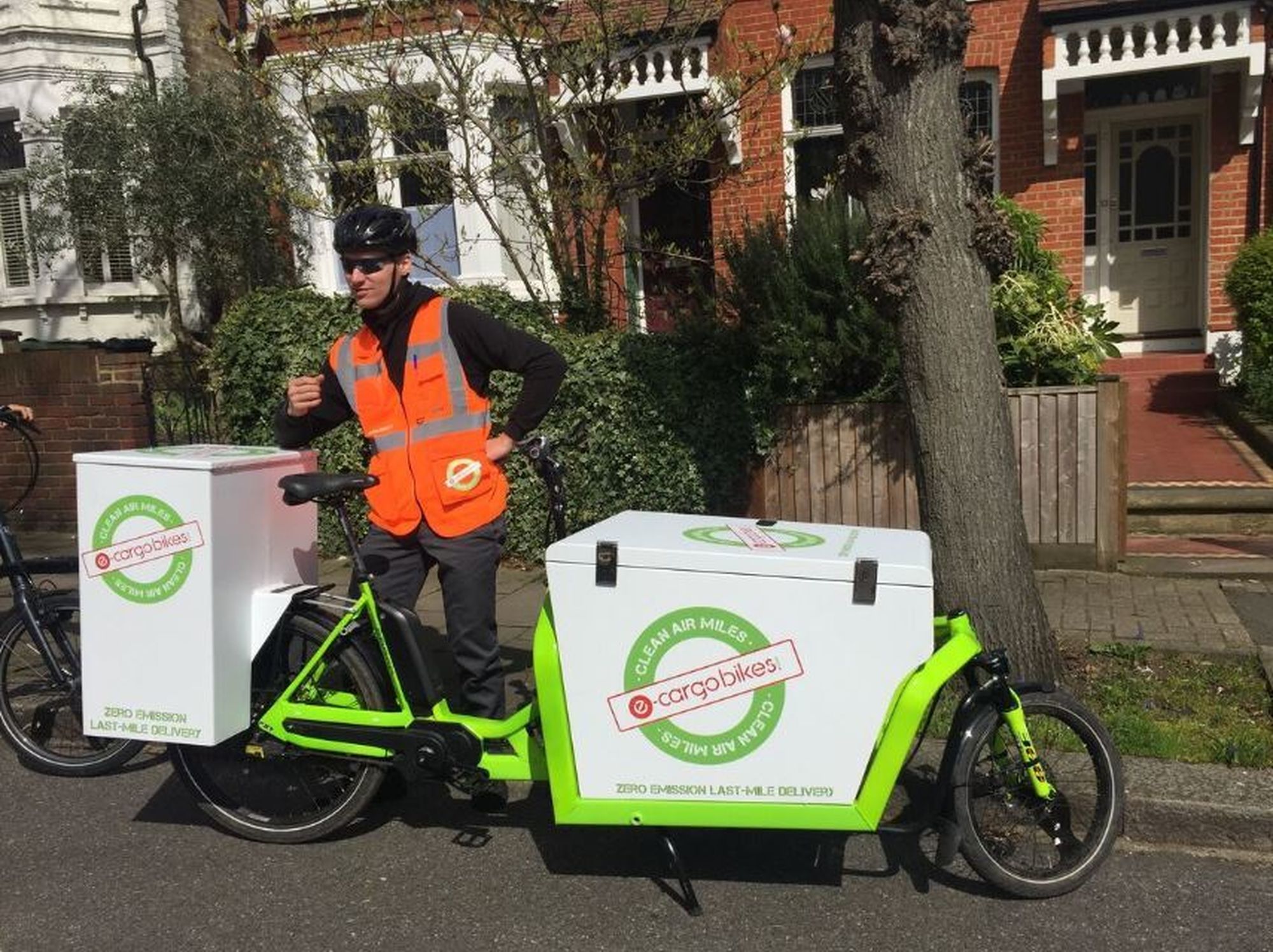 E-cargobikes.com Rider stands with e-cargo bicycle